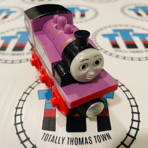 Rosie the pink Thomas the train on a wooden railroad Stock Photo